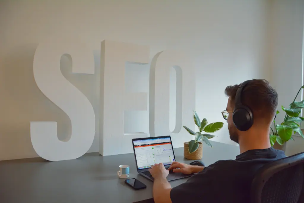 SEO professional at a computer representing search optimization practices to avoid