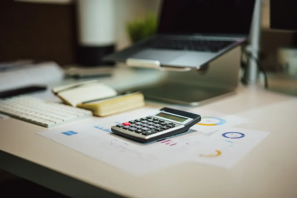 Calculator and business planning representing monthly SEO service packages